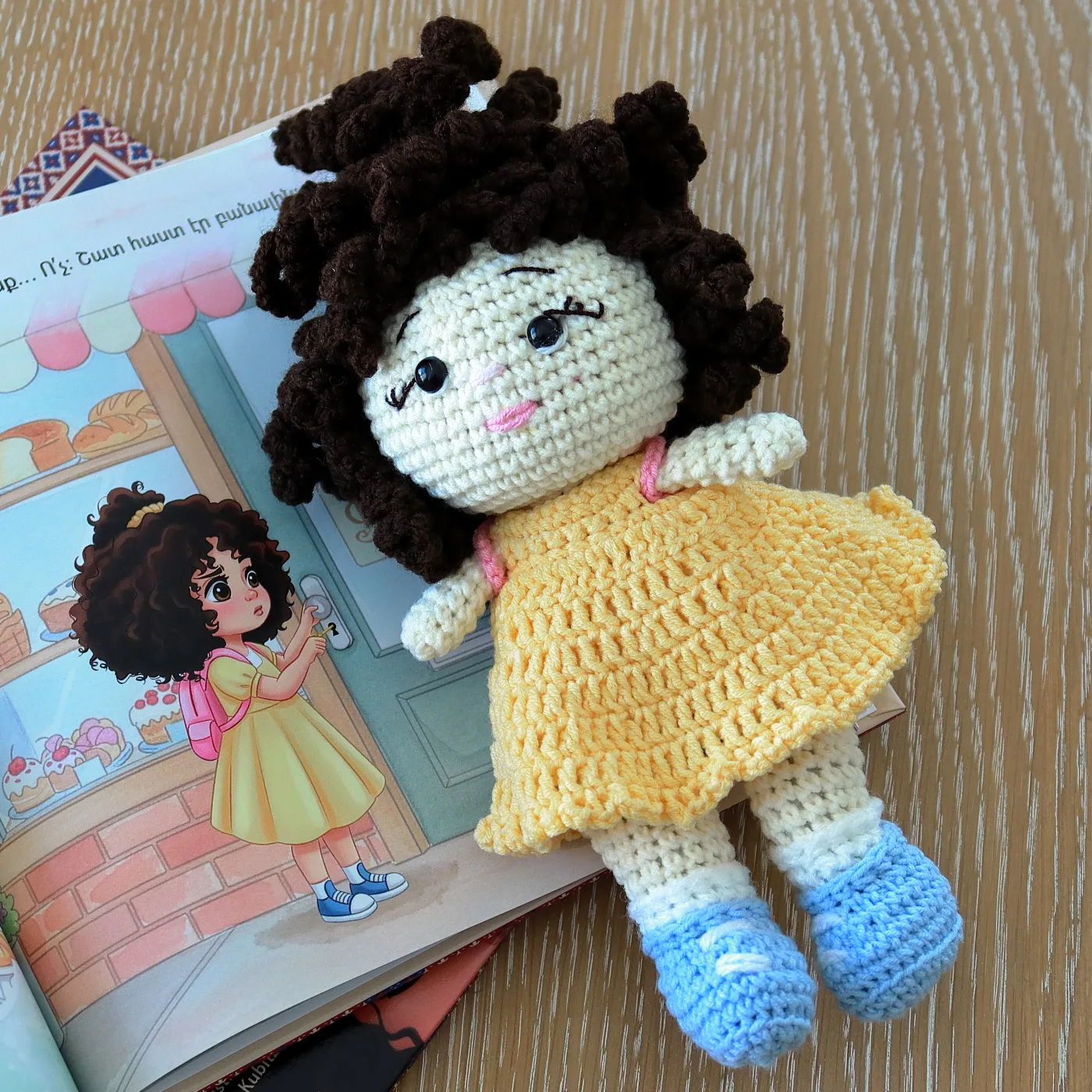 Lori doll on the illustrated book spread